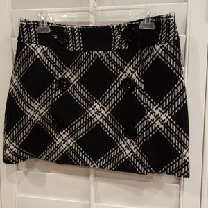 Plaid lined mini skirt with oversized buttons